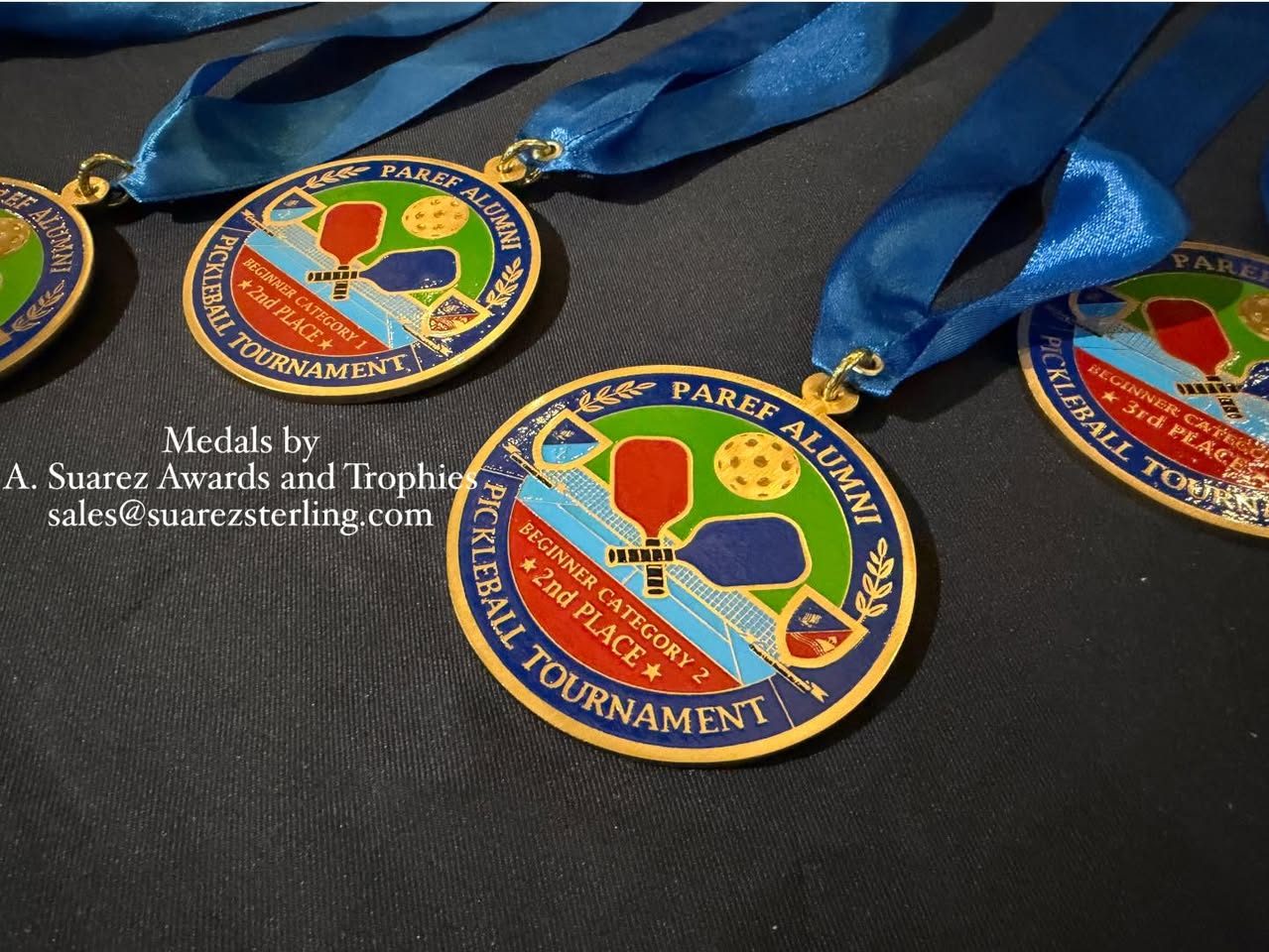 Full-colour pickleball tournament medals with crossed paddles, on blue satin ribbons